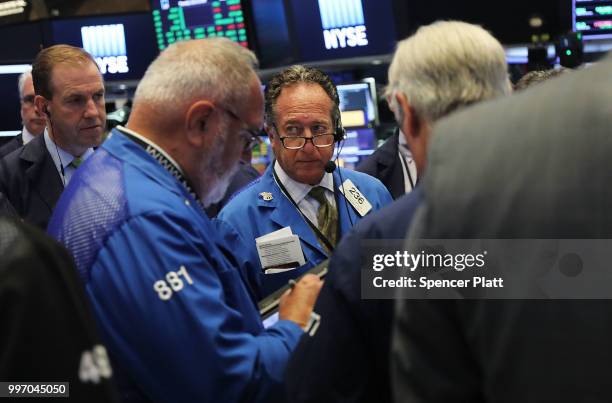 Traders work on the floor of the New York Stock Exchange on July 12, 2018 in New York City. As fears of a trade war eased with China, the Dow Jones...