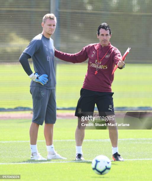 Arsenal Head Coach Unai Emery with goalkeeper Bernt Leno during a training session at London Colney on July 12, 2018 in St Albans, England.