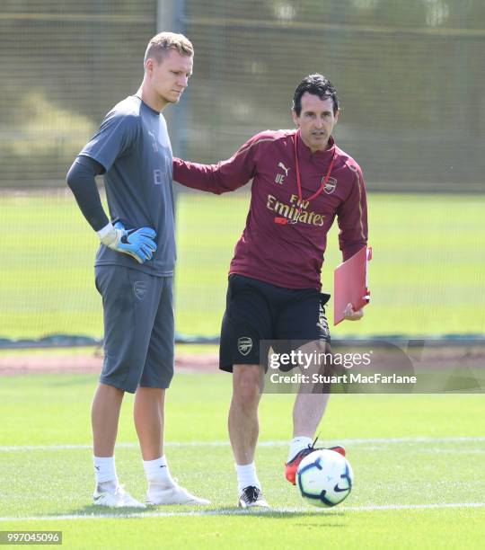 Arsenal Head Coach Unai Emery with goalkeeper Bernt Leno during a training session at London Colney on July 12, 2018 in St Albans, England.