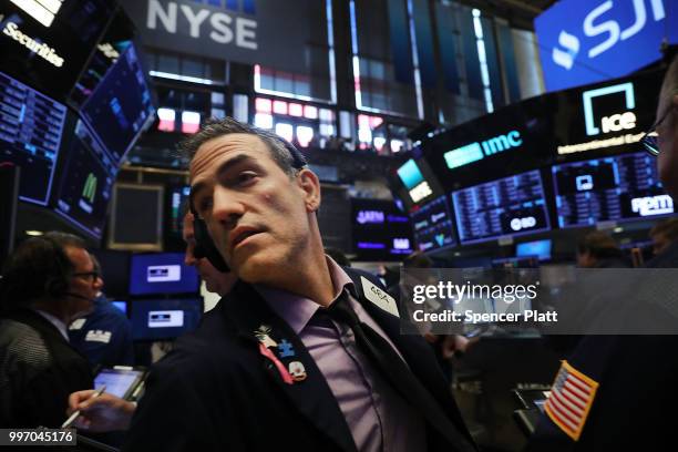 Traders work on the floor of the New York Stock Exchange on July 12, 2018 in New York City. As fears of a trade war eased with China, the Dow Jones...