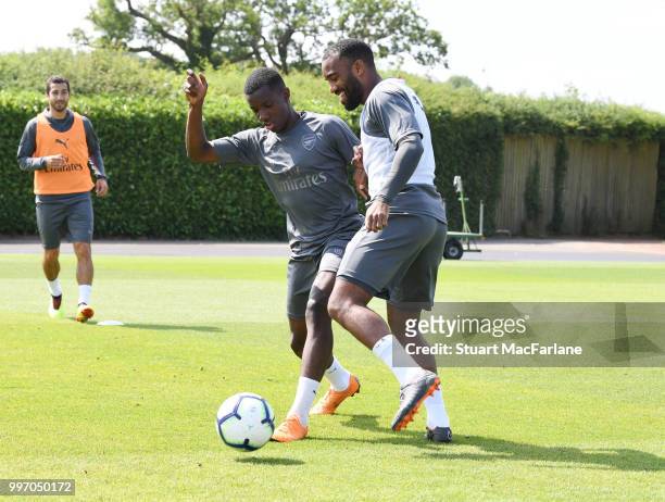 Eddie Eketiah and Alex Lacazette of Arsenal during a training session at London Colney on July 12, 2018 in St Albans, England.