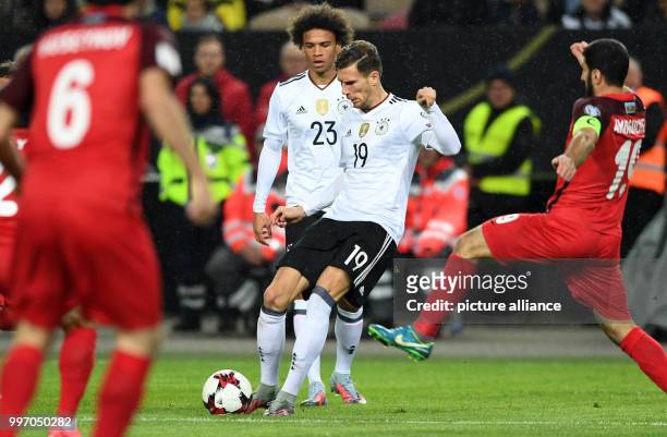 Germany's Leon Goretzka and Azerbaijan's Rahid Amirguliyev vie for the ball during the World Cup Group C quailification soccer match between Germany...