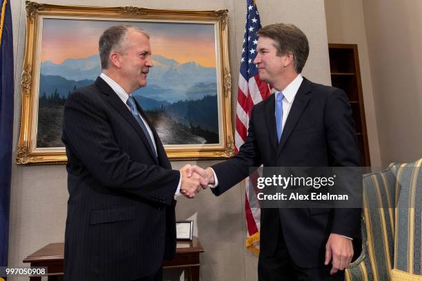 Sen. Dan Sullivan shakes hands with Judge Brett Kavanaugh prior to a meeting in the Hart Senate Office Building on July 12, 2018 in Washington, DC....