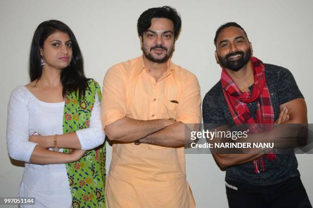 Indian actors Lakha Lakhwinder Singh , Babbar Gill , and actress Pooja Thakur pose during a promotional event for the upcoming Punjabi film 'Dhol...