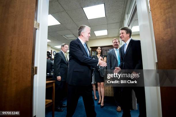 Sen. Dan Sullivan, R-Alaska, left, shakes hands with Supreme Court nominee Brett Kavanaugh during their photo-op before their meeting in the Hart...