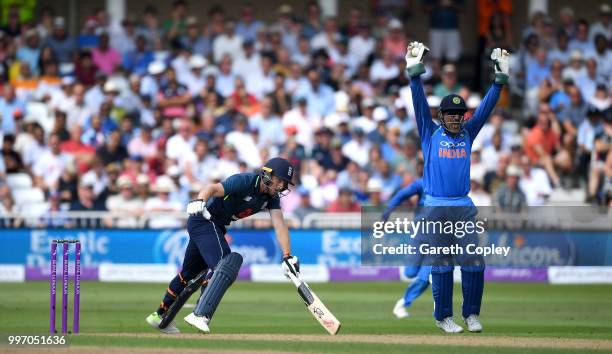 Jos Buttler of England is caught behind by MS Dhoni of India during the Royal London One-Day match between England and India at Trent Bridge on July...