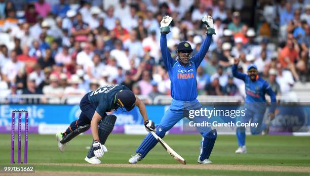 Jos Buttler of England is caught behind by MS Dhoni of India during the Royal London One-Day match between England and India at Trent Bridge on July...