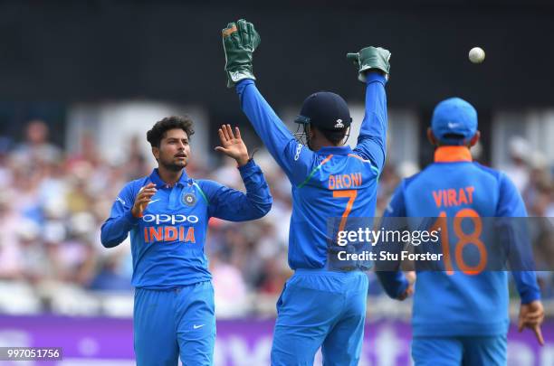 India bowler Kuldeep Yadav celebrates with MS Dhoni after the pair combine to dismiss Jos Buttler during the 1st Royal London One Day International...