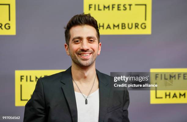 The director Özgür Yildirim arrives for the German premiere of the film "Nur Gott kann mich richten" during the Hamburg Film Festival in Hamburg,...