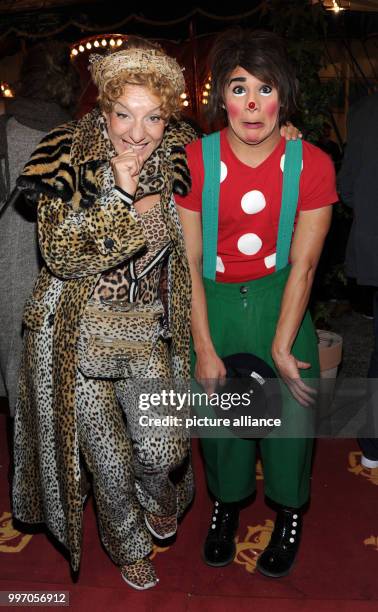 Cabaret artist Sissy Perlinger poses with a clown during the premiere gala of Circus Roncalli under the slogan "40 years of traveling towards the...