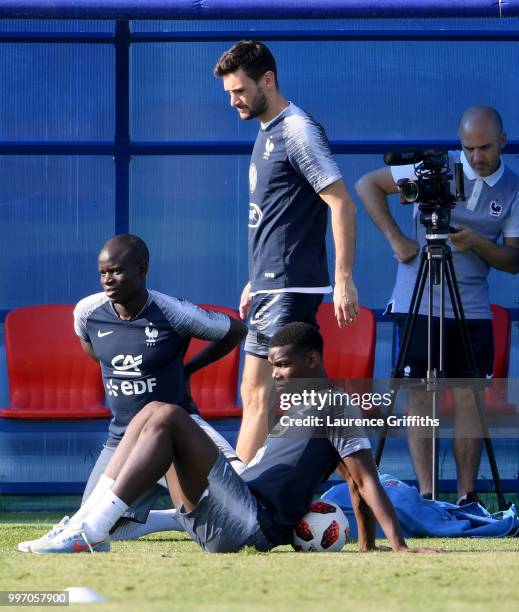 Ngolo Kante, Hugo Lloris and Paul Pogba look on during a France trainig session on July 12, 2018 in Moscow, Russia.