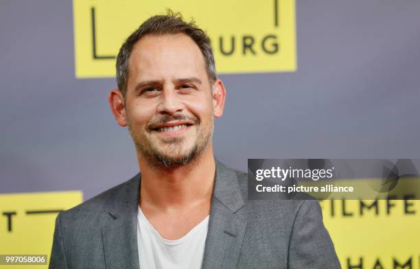 Actor Moritz Bleibtreu arrives for the German premiere of the film "Nur Gott kann mich richten" during the Hamburg Film Festival in Hamburg, Germany,...