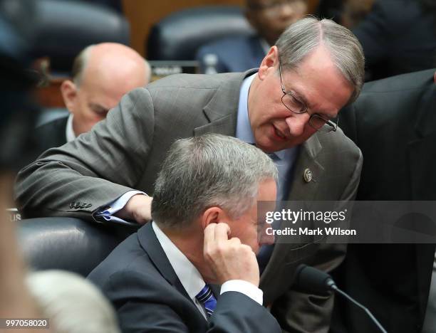 Chairman Bob Goodlatte talks with Rep. Mark Meadows during a hearing where Deputy Assistant FBI Director Peter Strzok appeared before a joint...