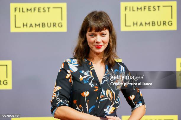 The actress Jessica Schwarz arrives for the German premiere of the film "Reich oder tot" during the Hamburg Film Festival in Hamburg, Germany, 7...