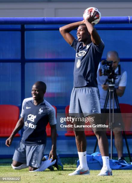 Ngolo Kante and Paul Pogba look on during a France trainig session on July 12, 2018 in Moscow, Russia.
