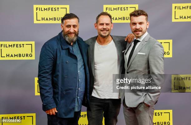 Actors Edin Hasanovic , Kida Khodr Ramadan and Moritz Bleibtreu arrive for the German premiere of the film "Nur Gott kann mich richten" during the...