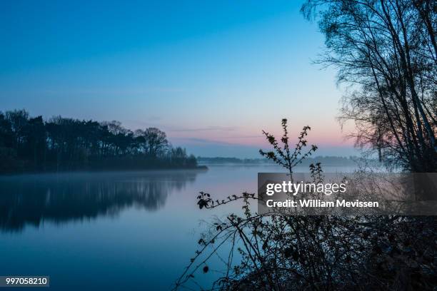 misty twilight bay view - william mevissen fotografías e imágenes de stock