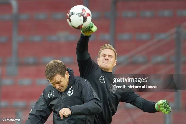 Goalkeeper Marc-Andre ter Stegen and team manager Oliver Bierhoff in action during the final training session before the 2018 World Cup qualification...