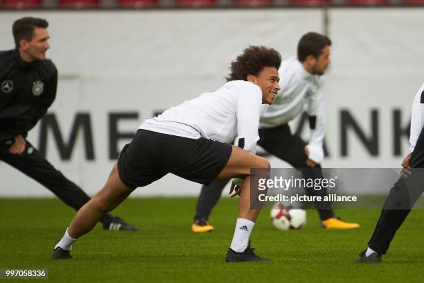 Leroy Sane warms up during Germany's final training session before the 2018 World Cup qualification match between Germany and Azerbaijan in Mainz,...