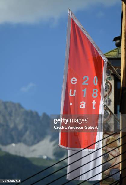 Flag reading "eu2018.at" flies during the European Union member states' interior and justice ministers conference on July 12, 2018 in Innsbruck,...