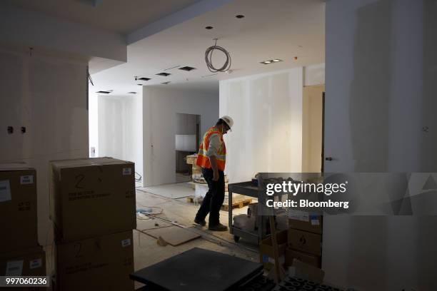 Worker stands in a unit during construction of the GWL Realty Advisors Livmore luxury apartment building in Toronto, Ontario, Canada, on Tuesday,...