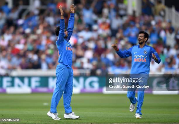 Kuldeep Yadav of India celebrates with Yuzvendra Chahal after dismissing David Willey of England during the Royal London One-Day match between...