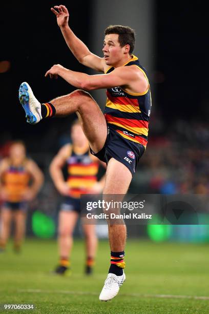 Luke Brown of the Crows kicks the ball during the round 17 AFL match between the Adelaide Crows and the Geelong Cats at Adelaide Oval on July 12,...