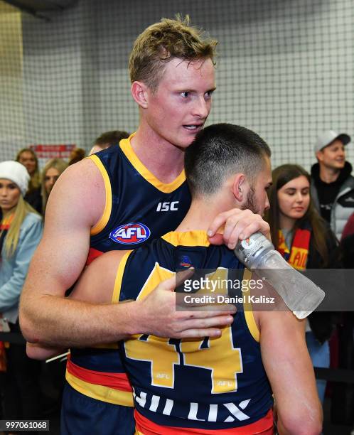 Alex Keath of the Crows and Lachlan Murphy of the Crows celebrate after the round 17 AFL match between the Adelaide Crows and the Geelong Cats at...