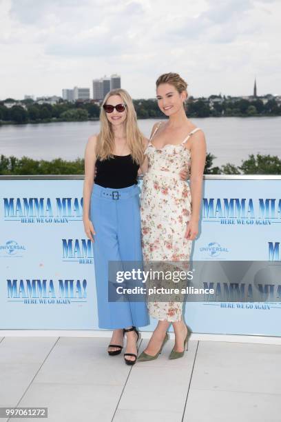 July 2018, Germany, Hamburg: American actress Amanda Seyfried , British actress Lily James at the photocall of "Mamma Mia 2". Photo: Daniel...