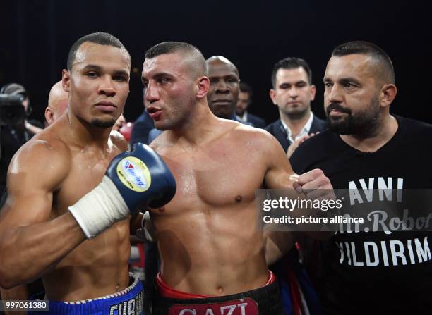 Britain's Chris Eubank Jr. Stands with Turkey's Avni Yildirim after their World Boxing Super Series IBO super-middleweight quarterfinals fight at the...