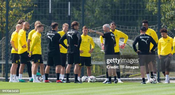 Head coach Lucien Favre of Dortmund speaks to his team during a training session at BVB training center on July 12, 2018 in Dortmund, Germany.