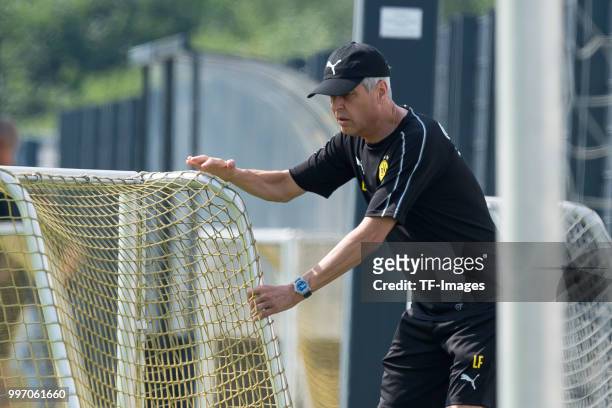 Head coach Lucien Favre of Dortmund controls the ball during a training session at BVB training center on July 12, 2018 in Dortmund, Germany.