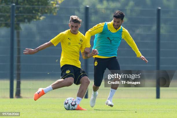 Maximilian Philipp of Dortmund and Nuri Sahin of Dortmund battle for the ball during a training session at BVB training center on July 12, 2018 in...