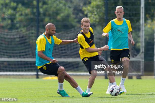 Oemer Toprak of Dortmund and Andre Schuerrle of Dortmund battle for the ball during a training session at BVB training center on July 12, 2018 in...