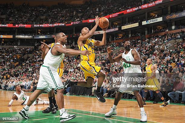 Price of the Indiana Pacers makes a layup against Michael Finley of the Boston Celtics on March 12, 2010 at the TD Garden in Boston, Massachusetts....