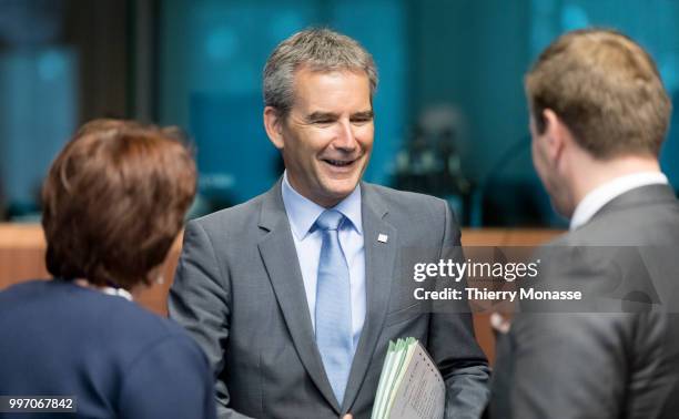 Austrian Finance Minister Hartwig Loeger is talking with staff members prior an Eurogroup Ministers meeting on july 12 in the Justus Lipsius, the EU...