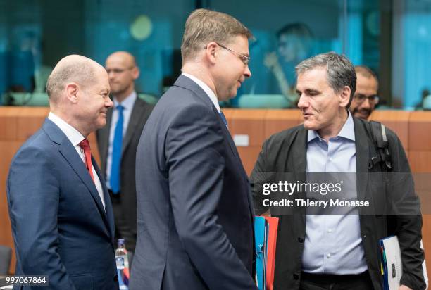 German Federal Minister of Finance Olaf Scholz is talking with the EU Euro & Social Dialogue Commissioner Valdis Dombrovskis and the Greek Finance...