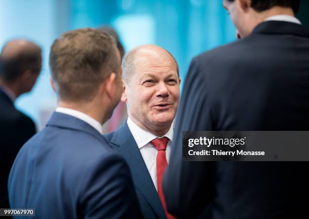 German Federal Minister of Finance Olaf Scholz is talking with counterparts prior an Eurogroup Ministers meeting on july 12 in the Justus Lipsius,...