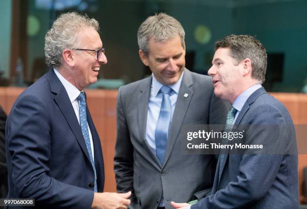 Luxembourg Minister of Finance, Treasury, & Budget Pierre Gramegna is talking with the Austrian Finance Minister Hartwig Loeger and the Irish...