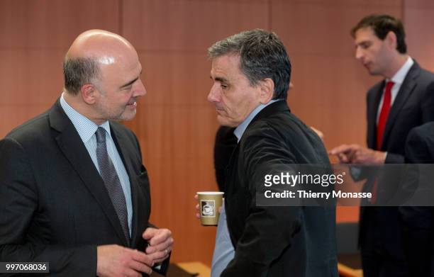 Economic and Financial Affairs, Taxation and Customs Commissioner Pierre Moscovici is talking with the Greek Finance Minister Euclid Tsakalotos and...