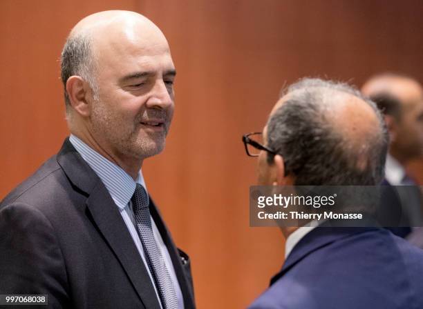 Economic and Financial Affairs, Taxation and Customs Commissioner Pierre Moscovici shakes hands with the Italian Minister Economy & Finance Giovanni...