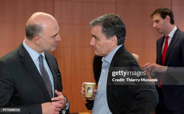 Economic and Financial Affairs, Taxation and Customs Commissioner Pierre Moscovici is talking with the Greek Finance Minister Euclid Tsakalotos and...