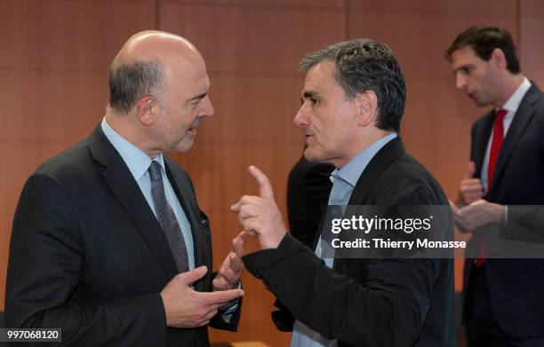 Economic and Financial Affairs, Taxation and Customs Commissioner Pierre Moscovici is talking with the Greek Finance Minister Euclid Tsakalotos and...