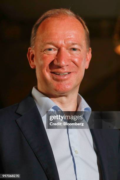 Mike Flewitt, chief executive officer of McLaren Automotive Ltd., poses for a photograph following a news conference at the Goodwood Festival of...