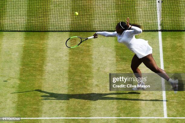 Serena Williams of The United States plays a backhand against Julia Goerges of Germany during their Ladies' Singles semi-final match on day ten of...