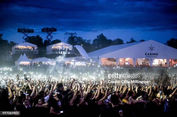 The crowd watch on with mobile phone lights as Tory Lanez performs onstage at the mainstage at The Plains of Abraham in The Battlefields Park during...