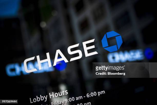 Signage is displayed outside a JPMorgan Chase & Co. Bank branch stands in Chicago, Illinois, U.S., on Tuesday, July 10, 2017. JPMorgan Chase & Co. Is...
