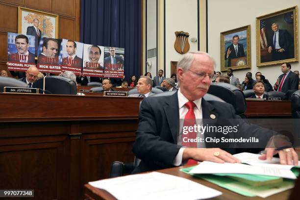 Images of people who have plead guilty in Special Counsel Robert Mueller's investigation are displayed as House Oversight and Government Reform...