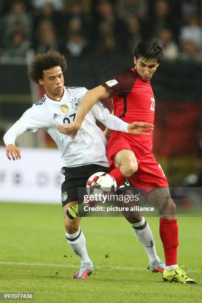 Germany's Leroy Sane and Azerbaijan's Afran Ismayilov vie for the ball during the World Cup Group C quailification soccer match between Germany and...