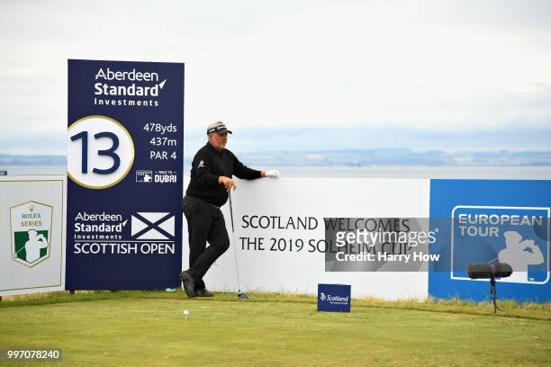 Darren Clarke of Northern Ireland waits to take his tee shot on hole thirteen during day one of the Aberdeen Standard Investments Scottish Open at...